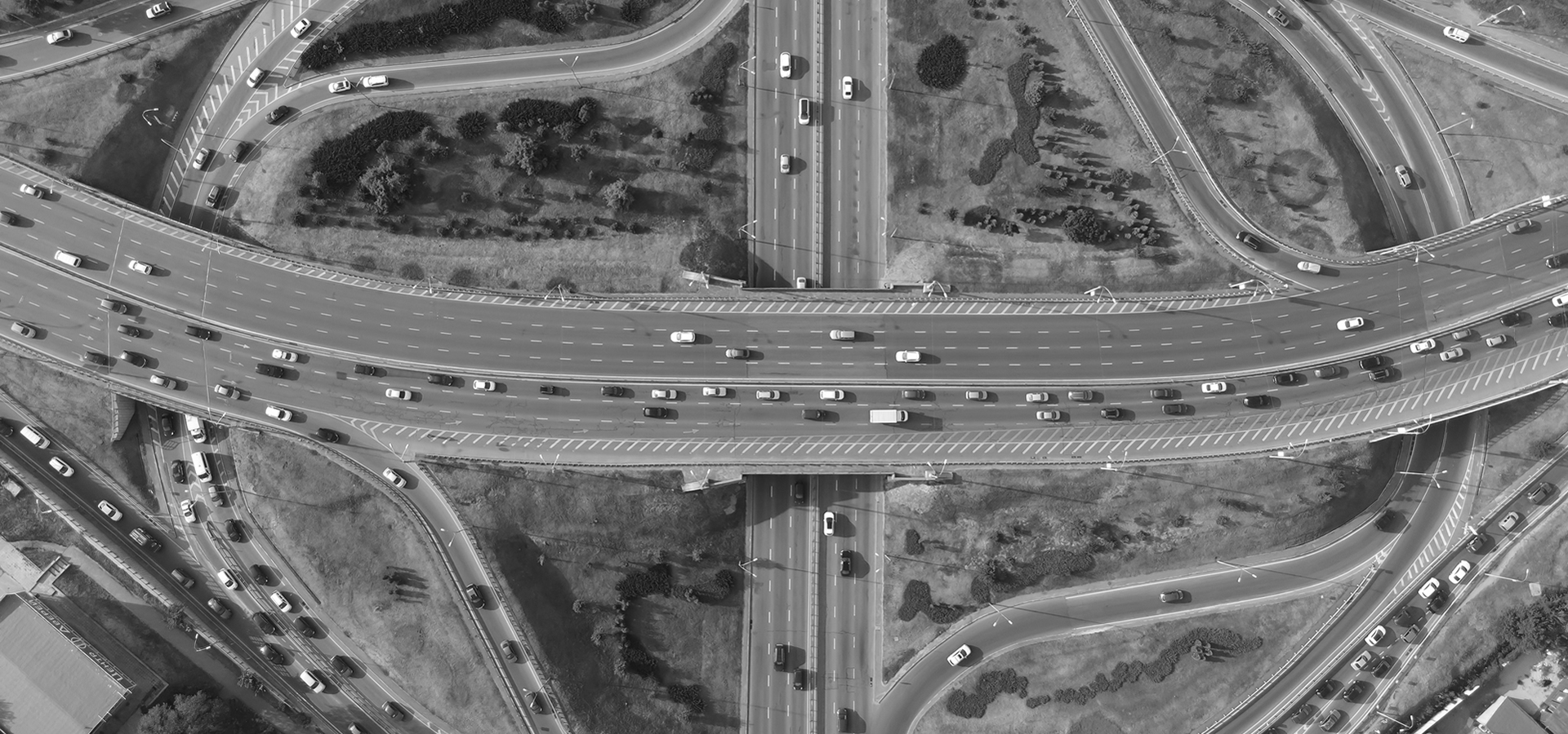 overhead view of motorway intersection and crowded slip roads